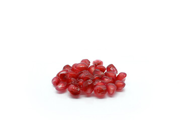 Pomegranate grains isolated on white background.