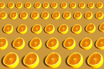 Lemons pattern. Repeating round half of lemon on an orange background. Lots of lemon halves on an orange surface. Horizontal. The concept of healthy food and vegetarianism.