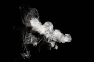Figured smoke isolated on a black background. Abstract background, design element, for overlay on pictures.