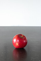 An apple a day keeps the doctor away, red apple isolated, black background, healthy life, vitamins
