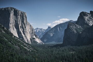 A panoramic view of the Yosemite Valley in California on a sunny day. On the left El Capitan rock. 