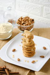 Stack of Gluten Free Almond Cookies set on white cafe table.