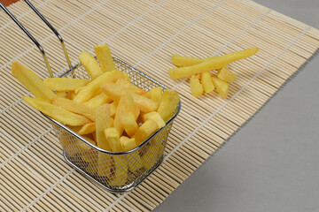portion of potato chips in a metal basket.