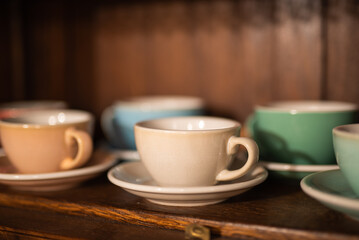 Antique wooden dresser with coffee cup on shelf