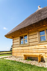 Detail of traditional thatched roof from straw or reed on sunny summer day