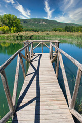 Footbridge over the water of the Uña lagoon in Cuenca