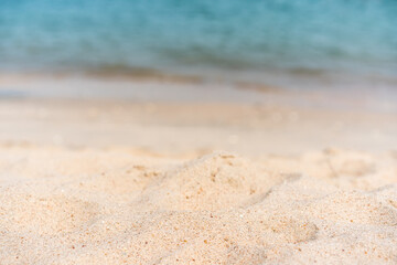 Fototapeta na wymiar Beautiful white sand beach in tropical ocean close up background