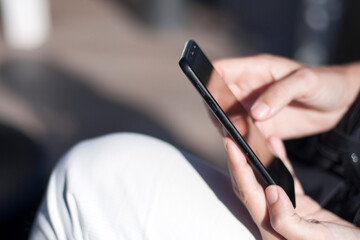 young girl hands with mobile phone