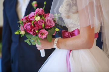 wedding day close up. newlyweds holding hands on marriage ceremony. groom and bride . wedding romantic moment close up. 