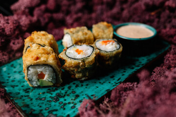 Dessert Maki Sushi - Roll with Various Fruit and Cream Cheese inside. Pancake outside. Served with Chocolate Sauce