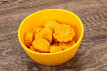 Marinated yellow patisson in the bowl