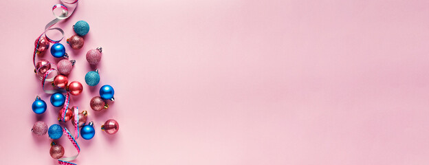 A lot of Christmas balls of pink color.