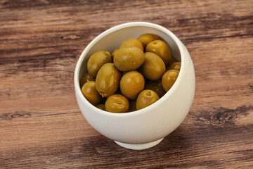 Green pickled olives in the bowl