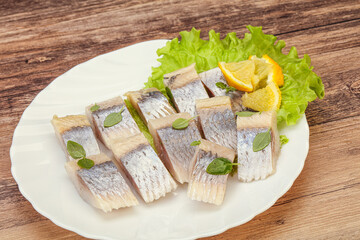 Herring fillet with sliced lemon
