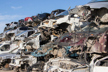 Fototapeta na wymiar cars waiting to be recycle in junk yard in Turkey, Ankara - stacked cars in car cemetery - auto graveyard