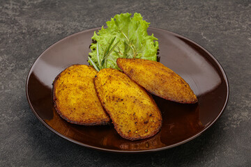 Baked potato with herbs and spices