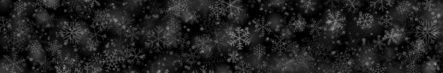 Fototapeta na wymiar Christmas banner of snowflakes of different shapes, sizes and transparency on black background