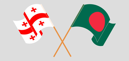 Crossed and waving flags of Bangladesh and Georgia