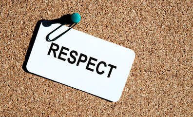 On the card the text of RESPECT, the card is attached to the board of hugs.