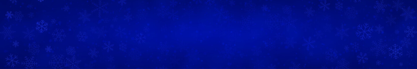 Christmas banner of snowflakes of different shapes, sizes and transparency on blue background