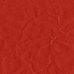 Red vintage and old looking crumpled paper background. Retro cardboard texture. Grunge paper for drawing. Ancient book page. Present wrapping.