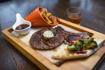 steak with potatoes and alcohol top view