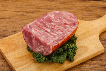 Beef ham piece over board