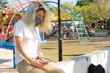 girl in the park wearing mask, during coronavirus outbreak