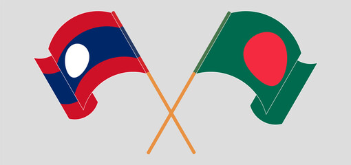 Crossed and waving flags of Bangladesh and Laos