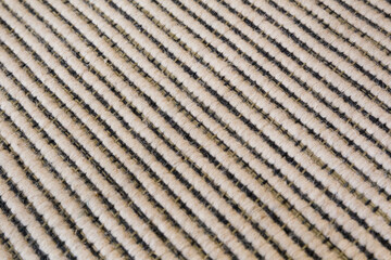 Surface of striped carpet in black and white