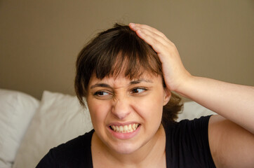 Portrait  of young brunette woman doing facial expressions