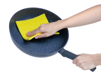 Frying pan kitchenware with cleaning sponge rag in hand on white background isolation