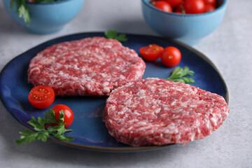 Raw aged burgers on kithcen table. Food photography ,coocking concept