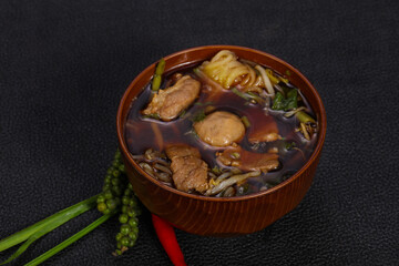 Thai style soup with meat and mushrooms