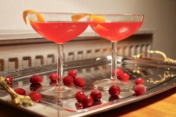 Cosmopolitan cocktails garnished with cranberries
