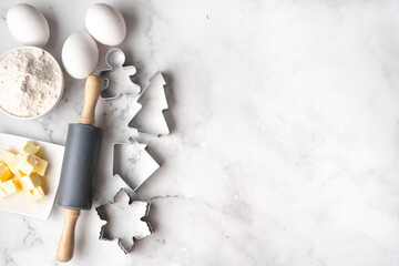 Fototapeta na wymiar White background with ingredients for Christmas cookies