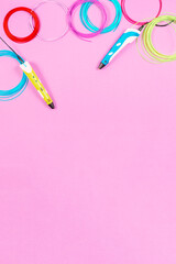 3d pens with colourful plastic filament on pink background