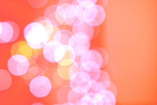 Blurry Christmas lights on a pink background. Pink background for Christmas