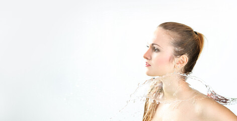 pretty woman with water splash. Copy space. Beautiful model