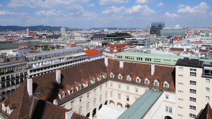 Fototapeta premium Aerial view of red roofs of sunny Vienna