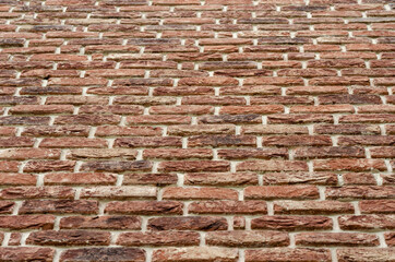 Texture of horizontal masonry of orange brick