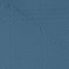 A blue vintage rough sheet of carton. Recycled environmentally friendly cardboard paper texture. Simple minimalist papercraft background.