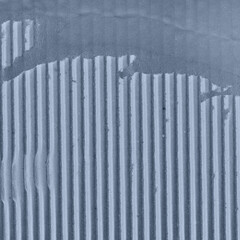 A blue vintage rough sheet of carton. Recycled environmentally friendly cardboard paper texture. Simple minimalist papercraft background.