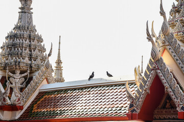 Beautiful traditional Thai Buddhist building's roof. Art on Thai temple roof church.
