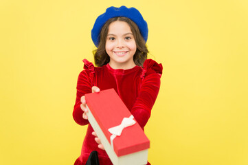 just take it. seasonal sale and discounts. happy birthday. retro kid fashion style. positive girl in vintage beret with gift box. trendy parisian child holding present. smiling teenager go shopping