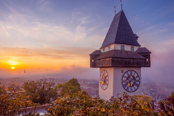 The famous clock tower on Schlossberg hill, in Graz, Styria region, Austria, at sunrise. Beautiful...