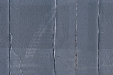 Fototapeta premium A blue vintage rough sheet of carton. Recycled environmentally friendly cardboard paper texture. Simple minimalist papercraft background.