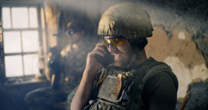 American soldier speaking on smartphone