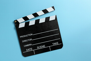 clapperboard on blue