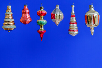 Set of vintage Christmas toys to decorate the Christmas tree on a blue background. Christmas card with place for your text.